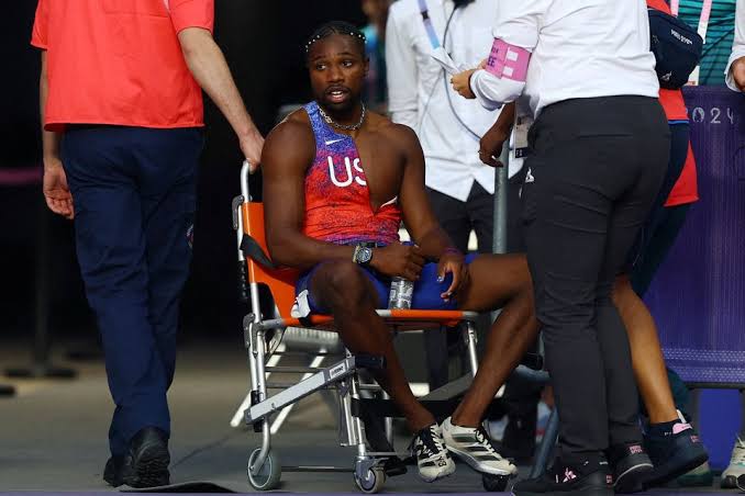 Breaking: After winning bronze in 200m, COVID-positive Noah Lyles leaves the stadium in a wheelchair. See more...