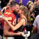 Watch: Taylor Swift and Travis Kelce share a sweet display of affection in front of their fathers following the Chiefs' victory.  