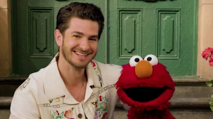 Andrew Garfield opens up to Elmo about his mother — who recently passed away “When I miss her, I remember it’s because she made me so happy, so I can celebrate her and miss her at the same time”